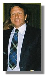 sir Rocco Forte wearing&nbsp; an Italian National Tartan tie presented to him by Clan Italia